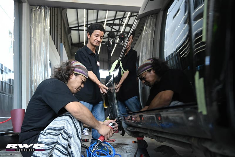 Nakai working with team