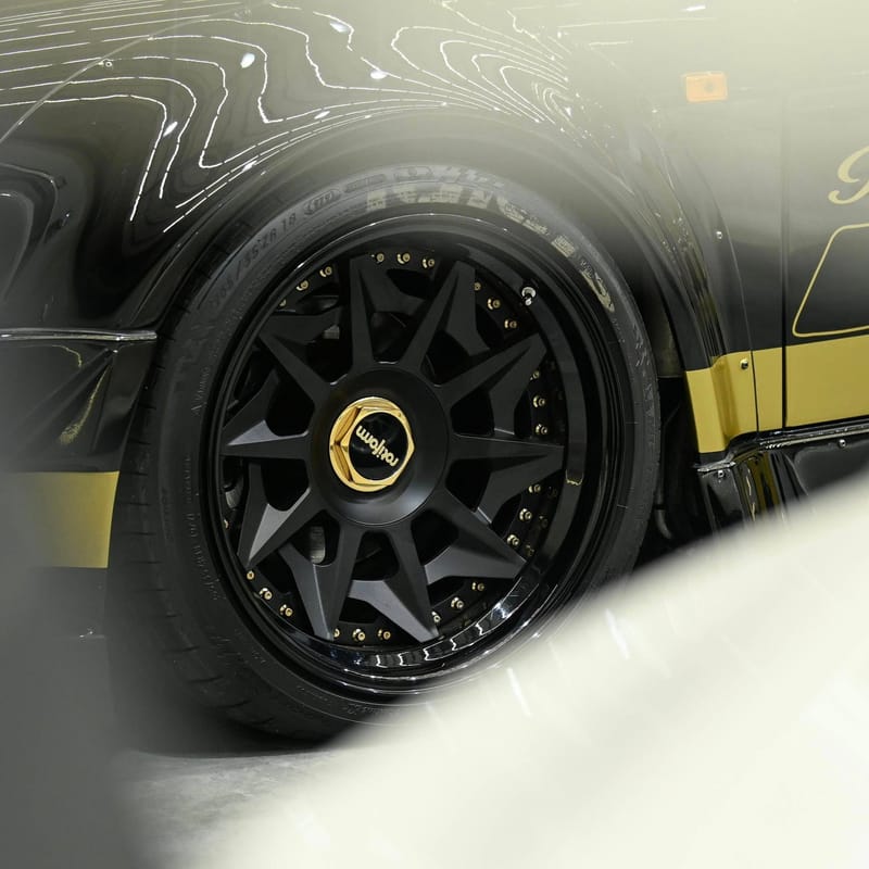 Black wheel with gold center cap