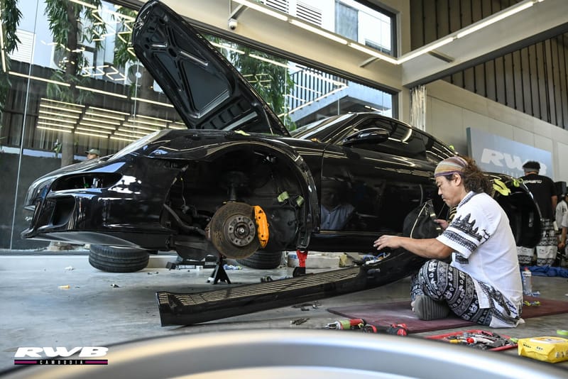 Car stripped, Nakai kneeling beside