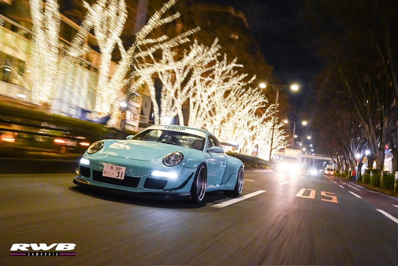 Bella and another RWB on illuminated boulevard